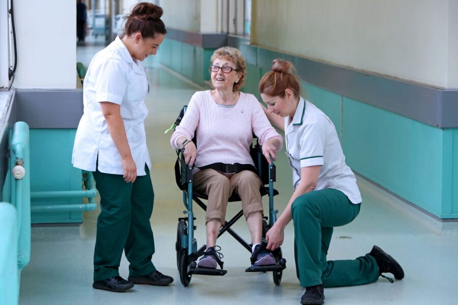 Therapists with patient with wheelchair