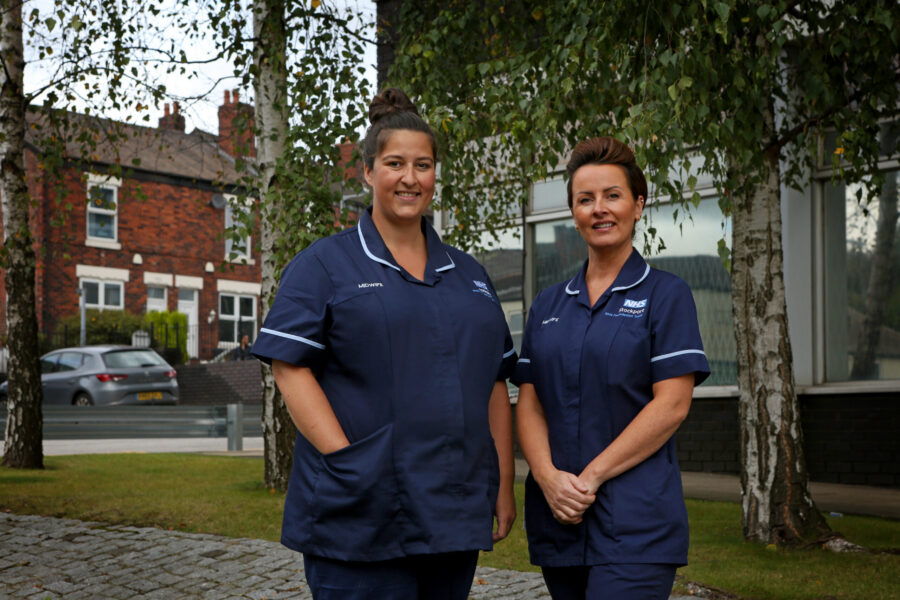 Two nursing staff outside